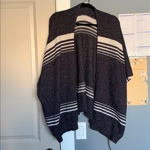 Knitted poncho.